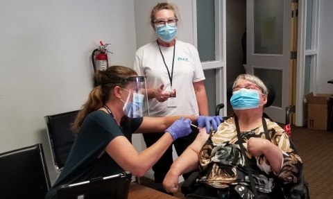 A pace client getting covid vaccine